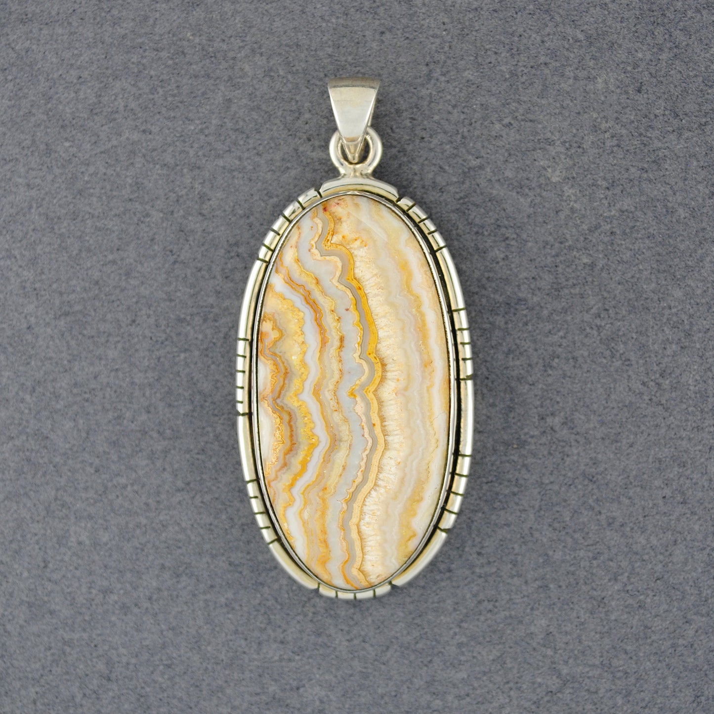 Sterling Silver Crazy Lace Agate Notched Long Oval Pendant